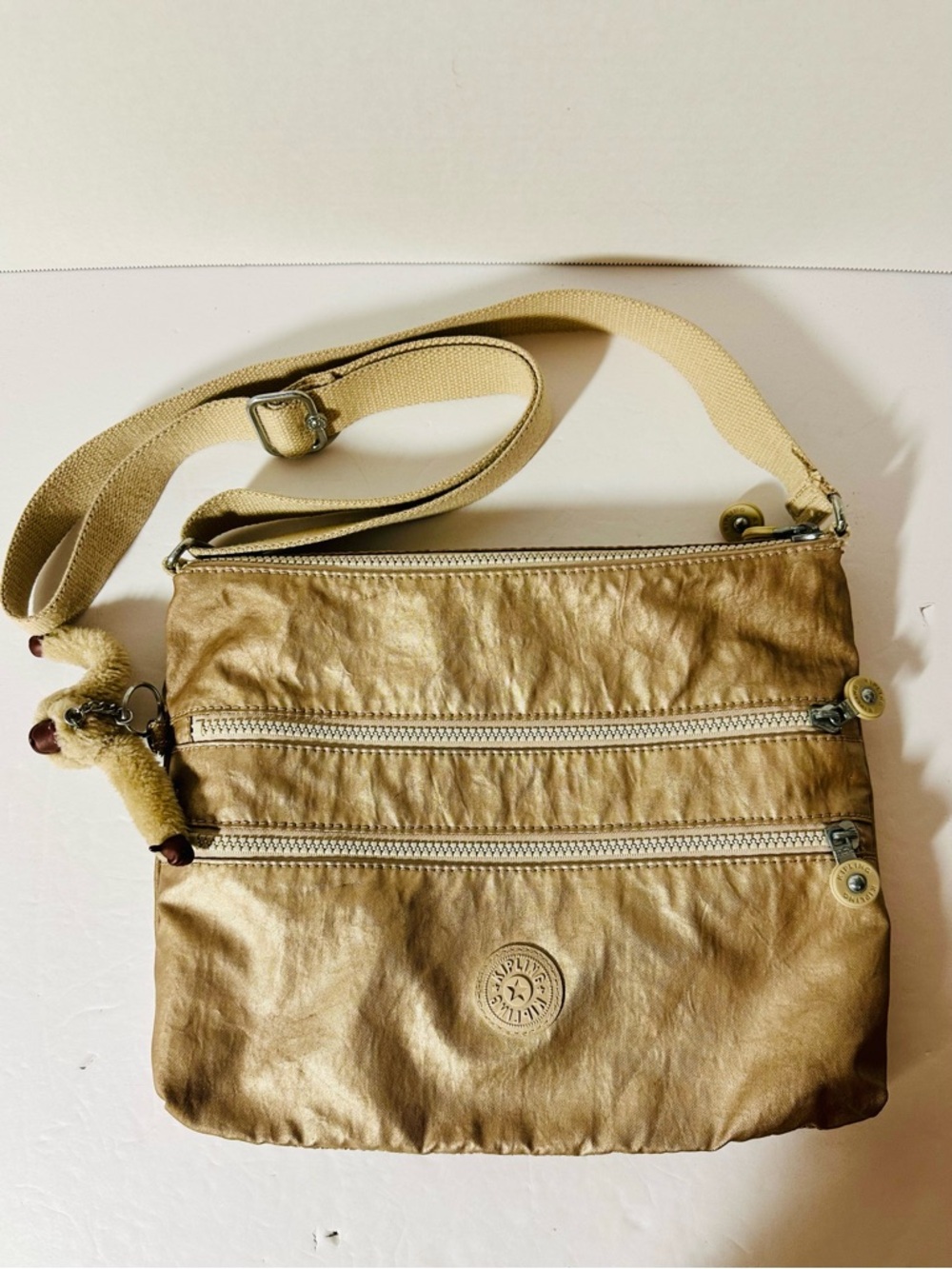 Kipling Beige Crossbody Shoulder Bag with Adjustable Strap & Three Zip Pockets